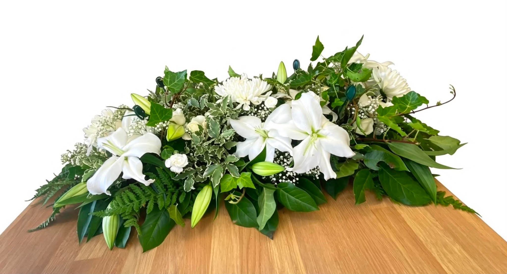 White lily and greenery casket spray