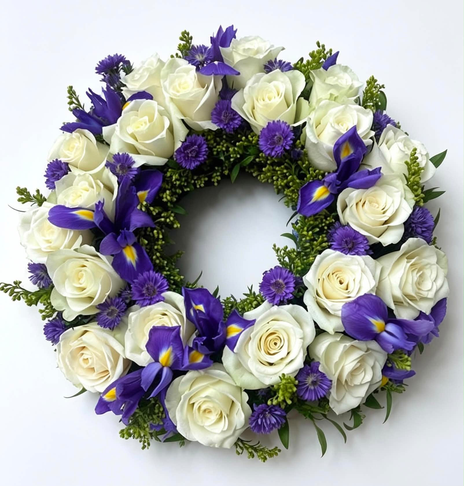 White rose and purple iris funeral wreath